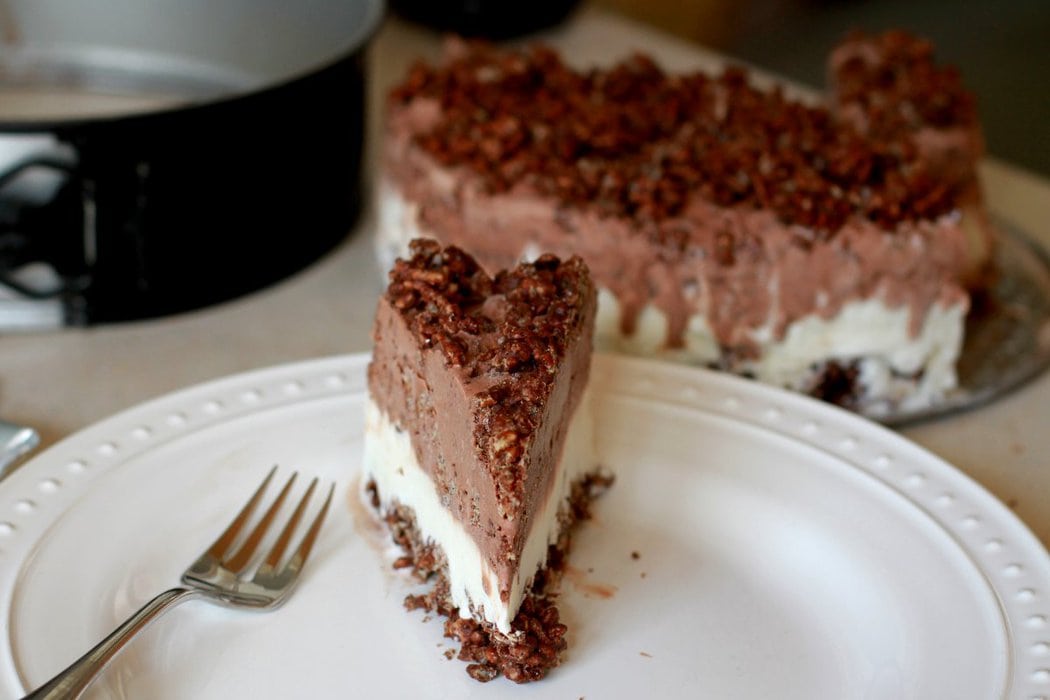 Slice of Cream Crunch Cake on a white plate.