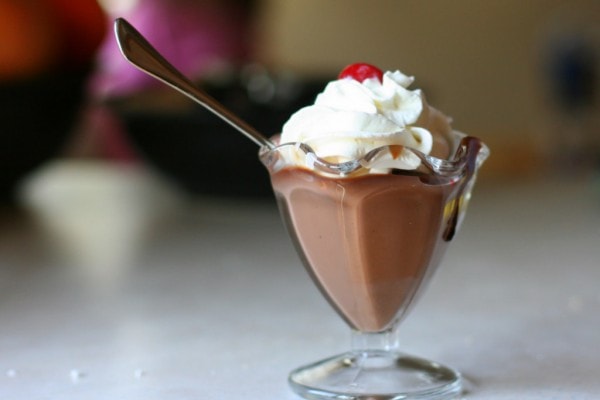 Chocolate pudding in a parfait glass.