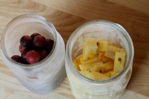 fruit frozen in glass mason jar.