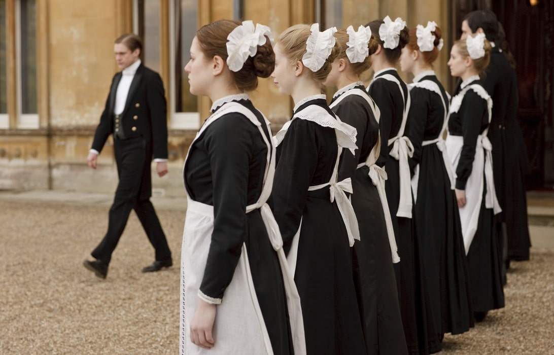 A row of maids from Downton Abbey.