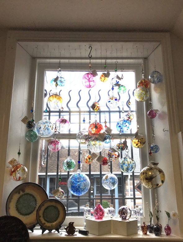 blown glass balls hanging in window