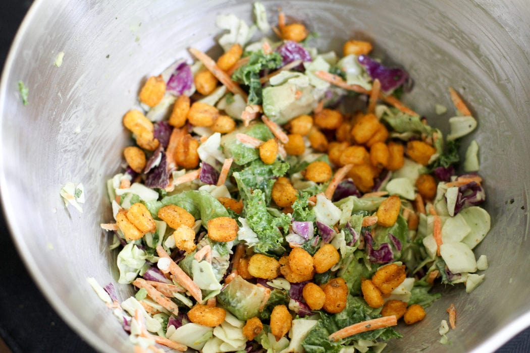 Cabbage salad in a metal bowl.