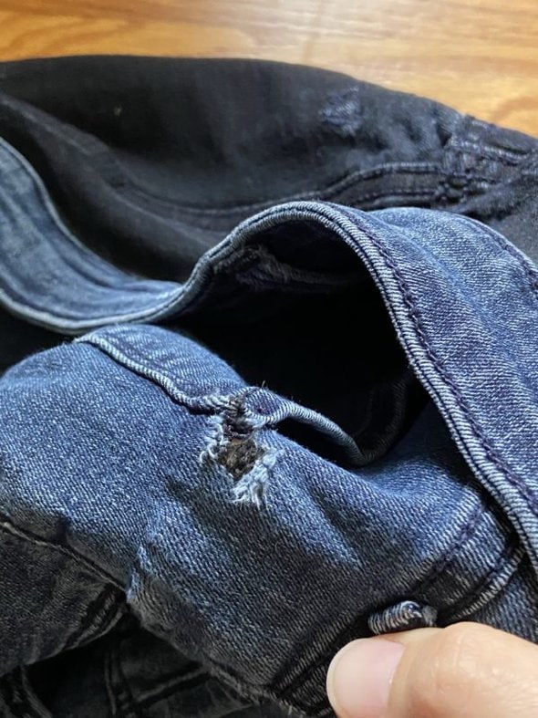 hole in jeans.