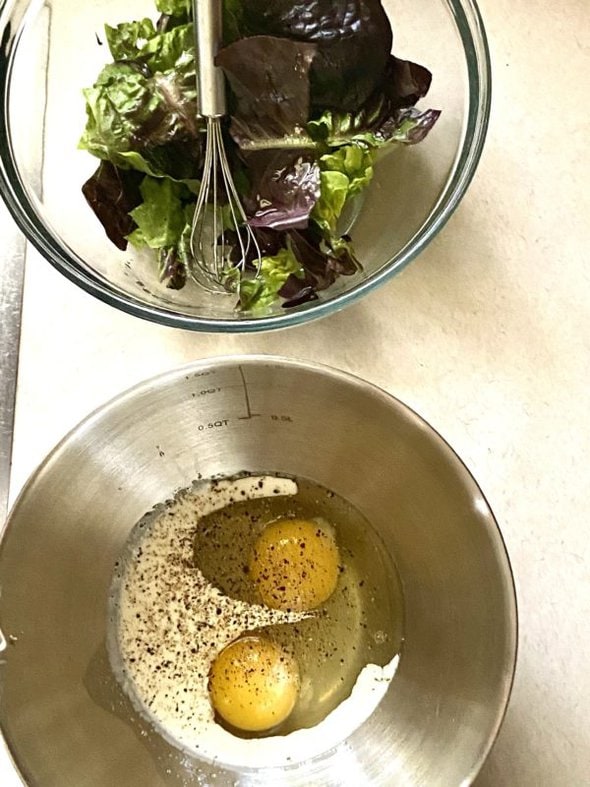bowl of greens and bowl of eggs.