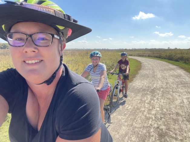 liz biking with her kids.