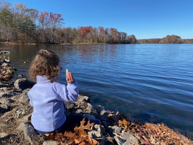little girl by lake.