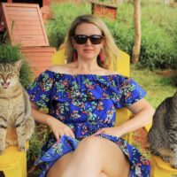 Colleen with some cats.