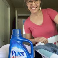Kristen with a bottle of Purex laundry deterent.