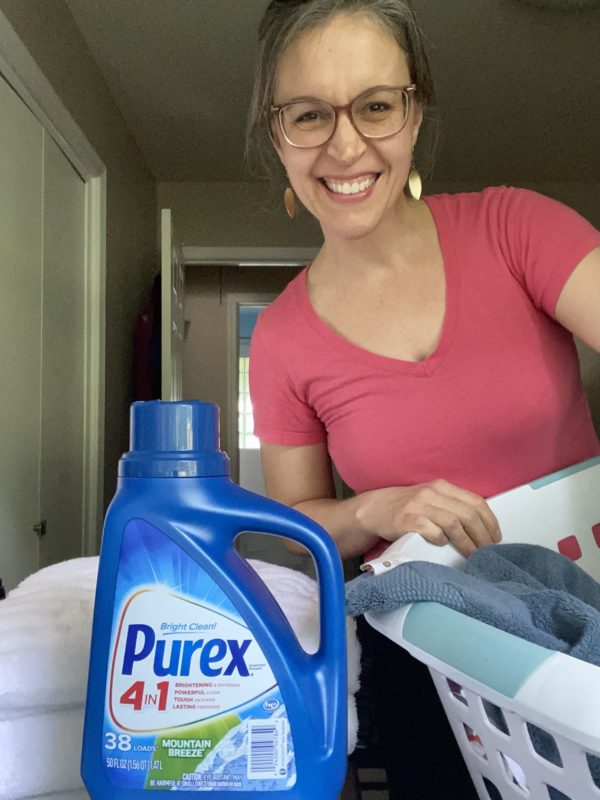 Kristen with a bottle of Purex laundry deterent.