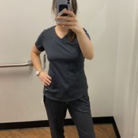 Kristen in gray scrubs.