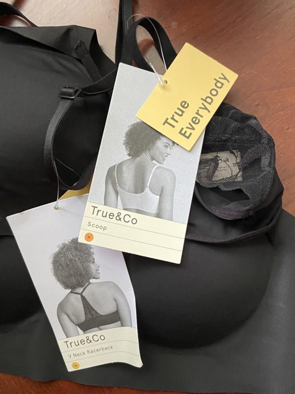 two black bras with tags attached.