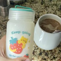 glass jar and a cup of coffee.