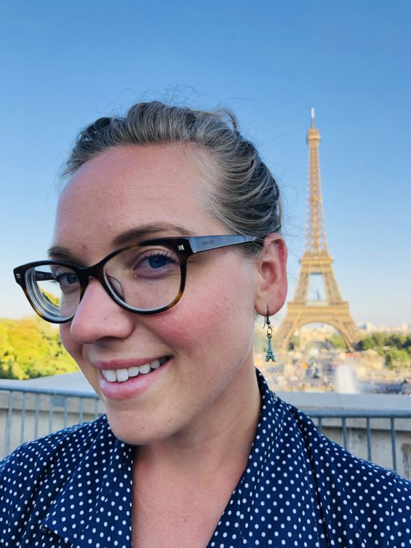 woman in front of eiffel tower.