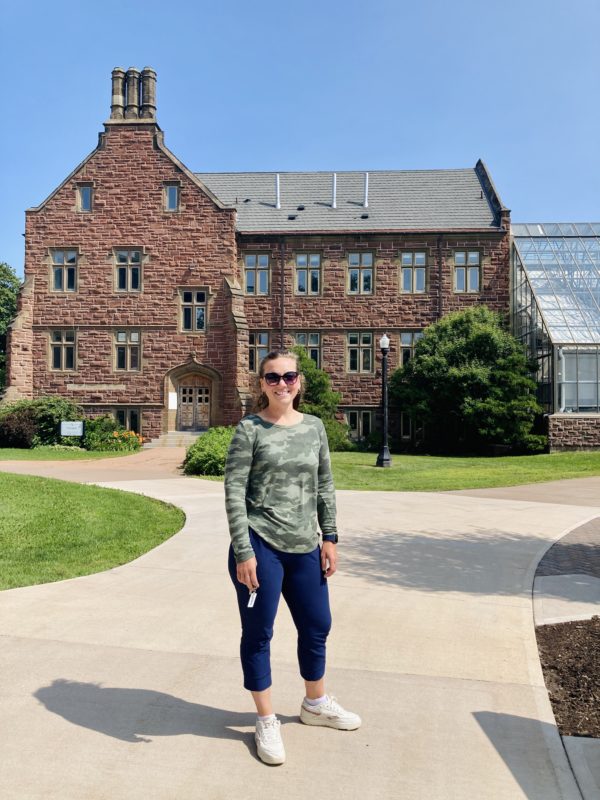 woman in front of college.