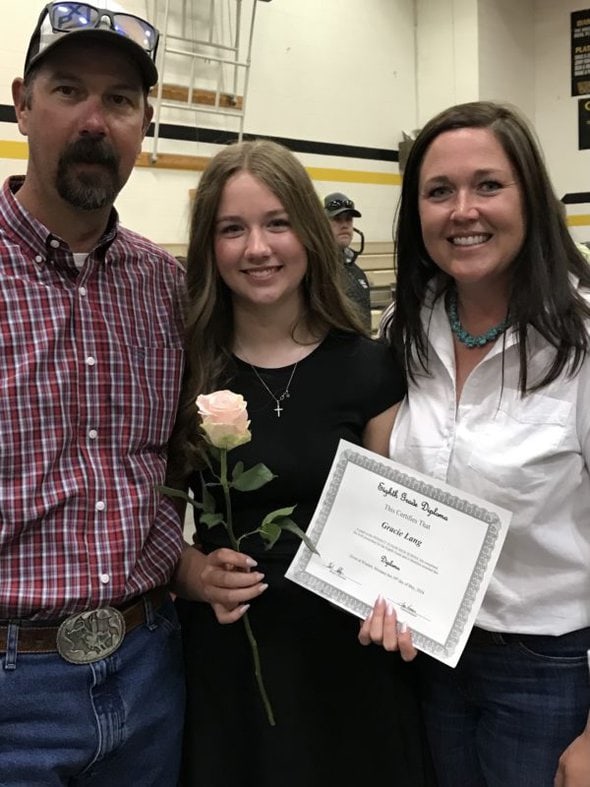 mom and dad with daughter.