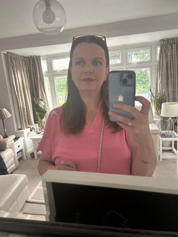 reader in a mirror selfie.