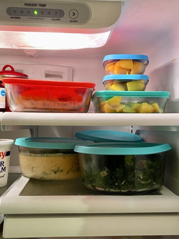 fridge shelves with glass containers on them.