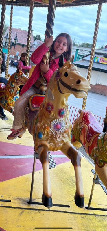 girl on merry go round.