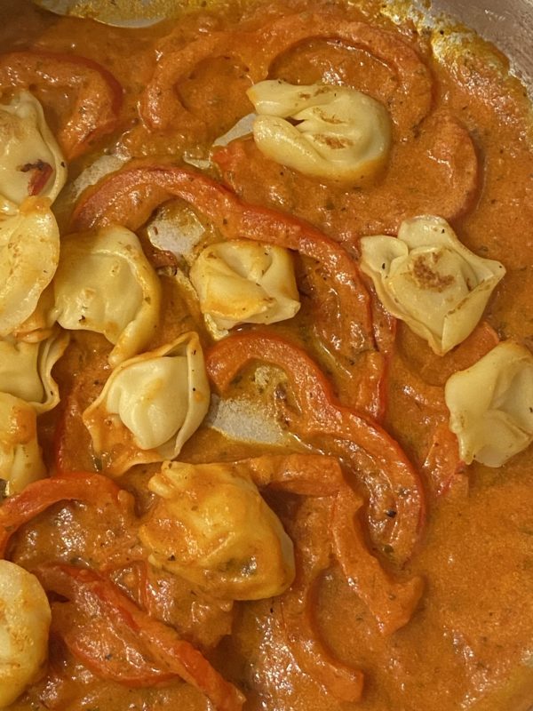 red pepper sauce on tortellini.