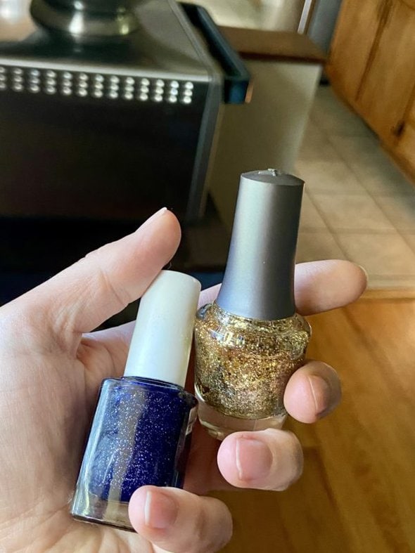 two bottles of sparkly nail polish.