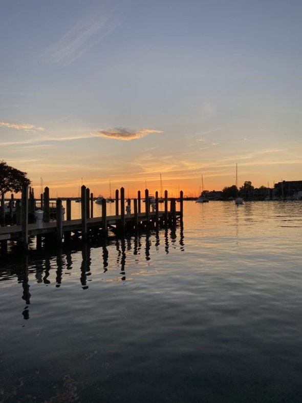 sunrise behind a pier.