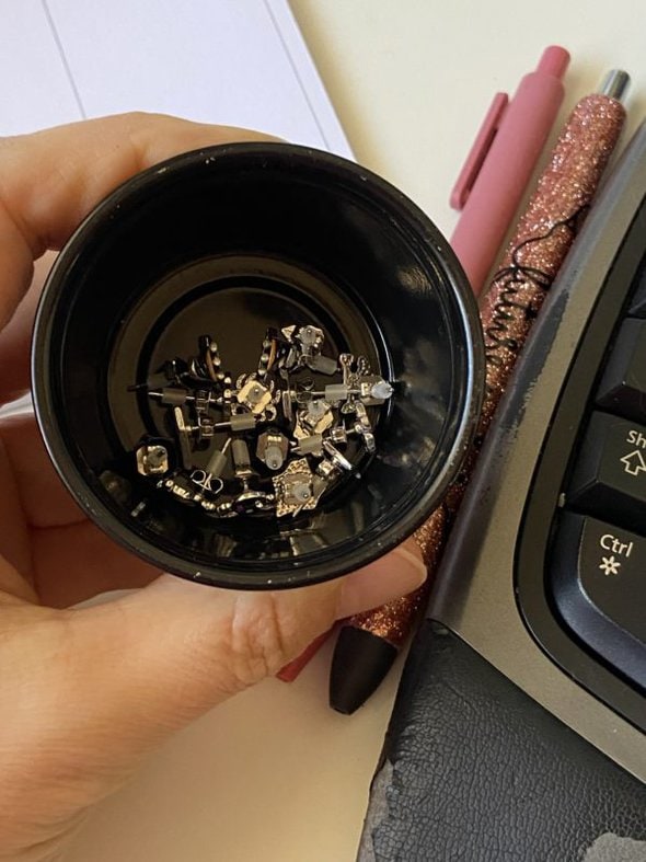 earrings in a container.