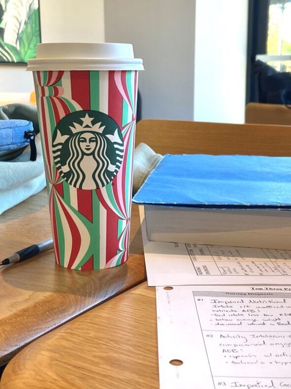 starbucks cup on table.