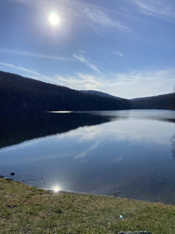 sun over a lake.