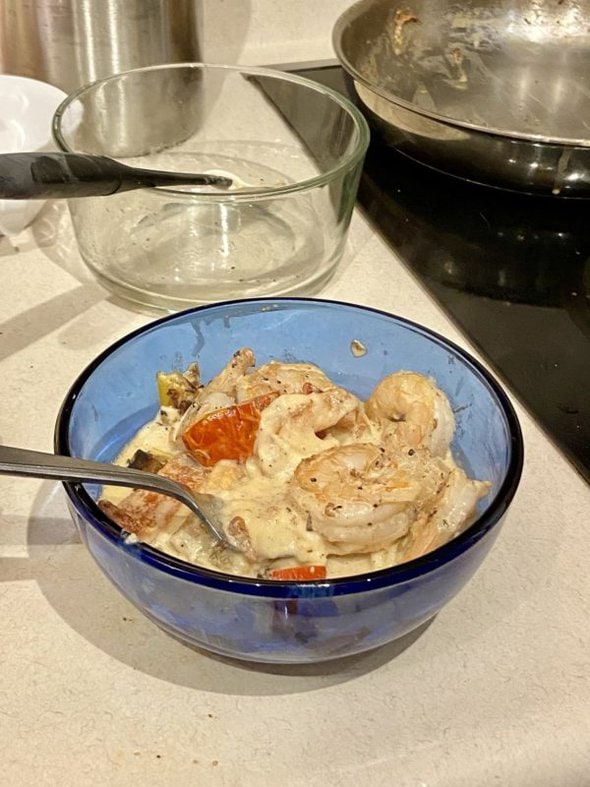 shrimp and mashed potatoes in blue bowl.