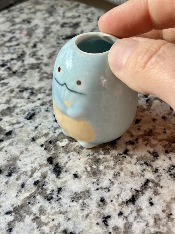 glued toothbrush holder.